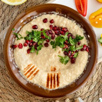 a plate of mortar and pestle hummus