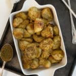 a white dish with roasted zaatar potatoes