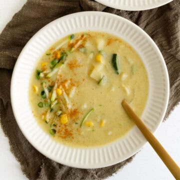 a bowl of creamy zucchini corn chowder