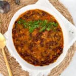 black bean curry in a white bowl
