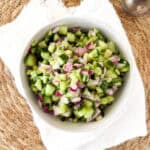 cucumber onion salad with vinegar and sugar in a bowl