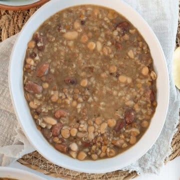 makhlouta bean and grain stew in a white bowl