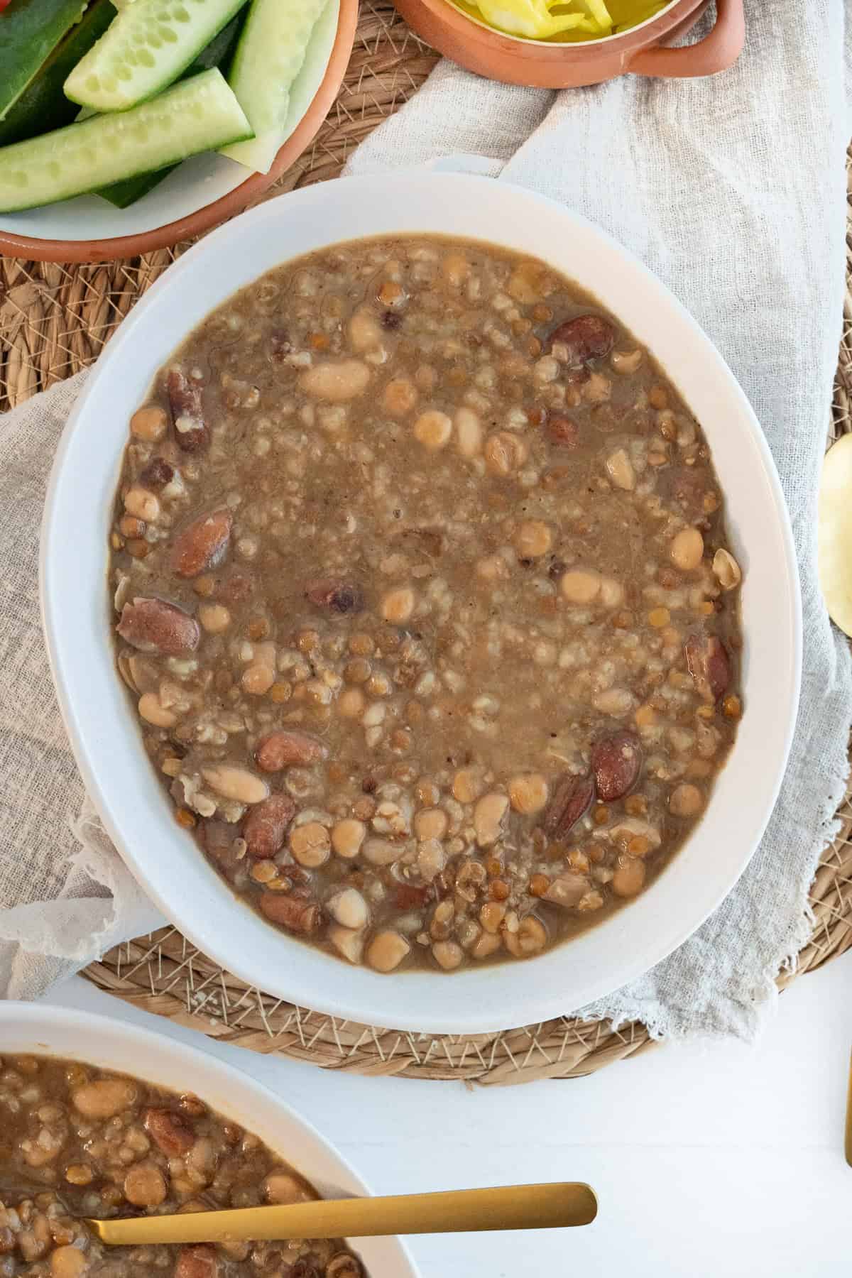 makhlouta bean and grain stew in a white bowl