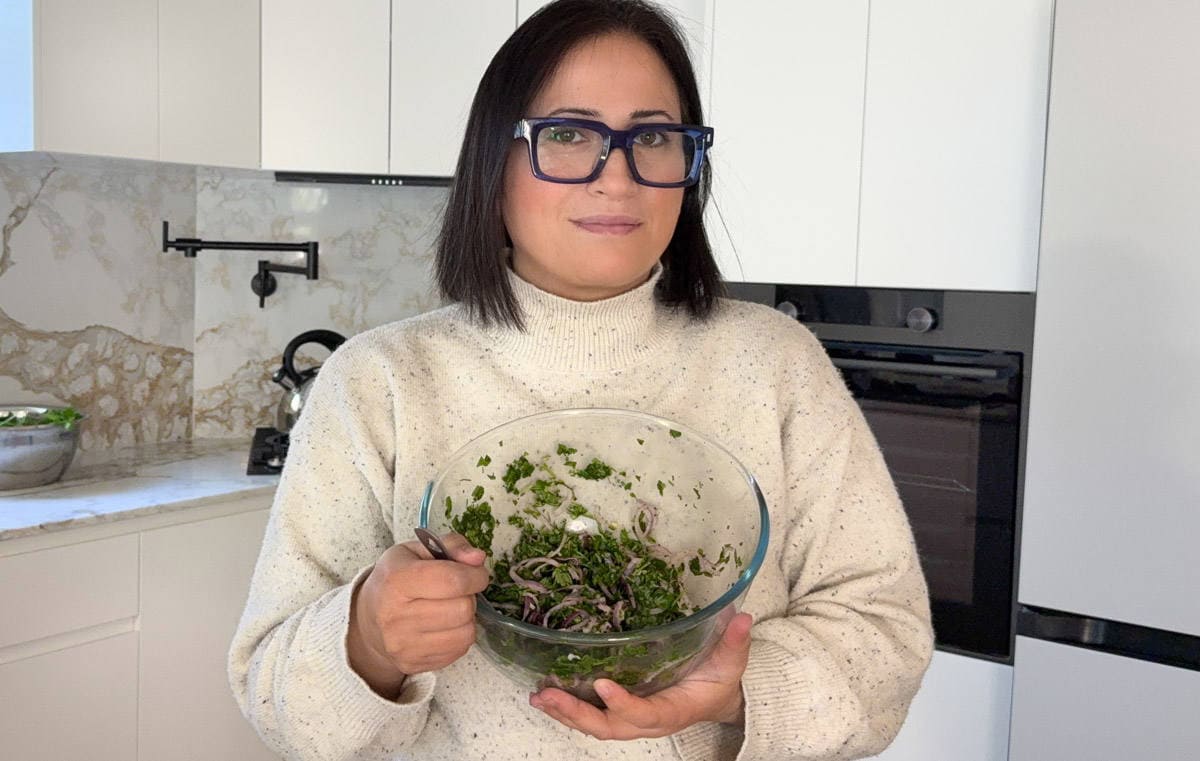 female holding biwaz salad in a bowl