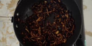 frying onion in a pan