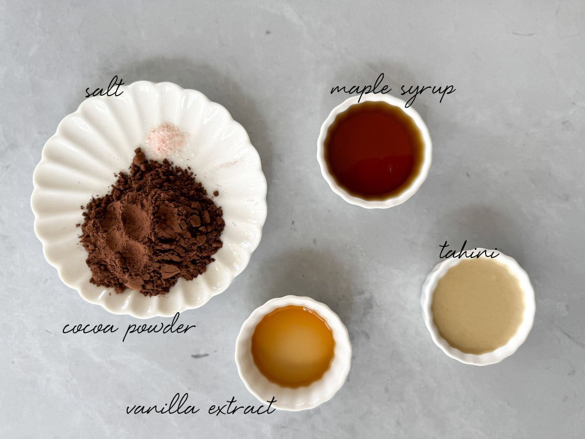 cocoa powder, tahini, maple syrup, vanilla extract and salt in bowls
