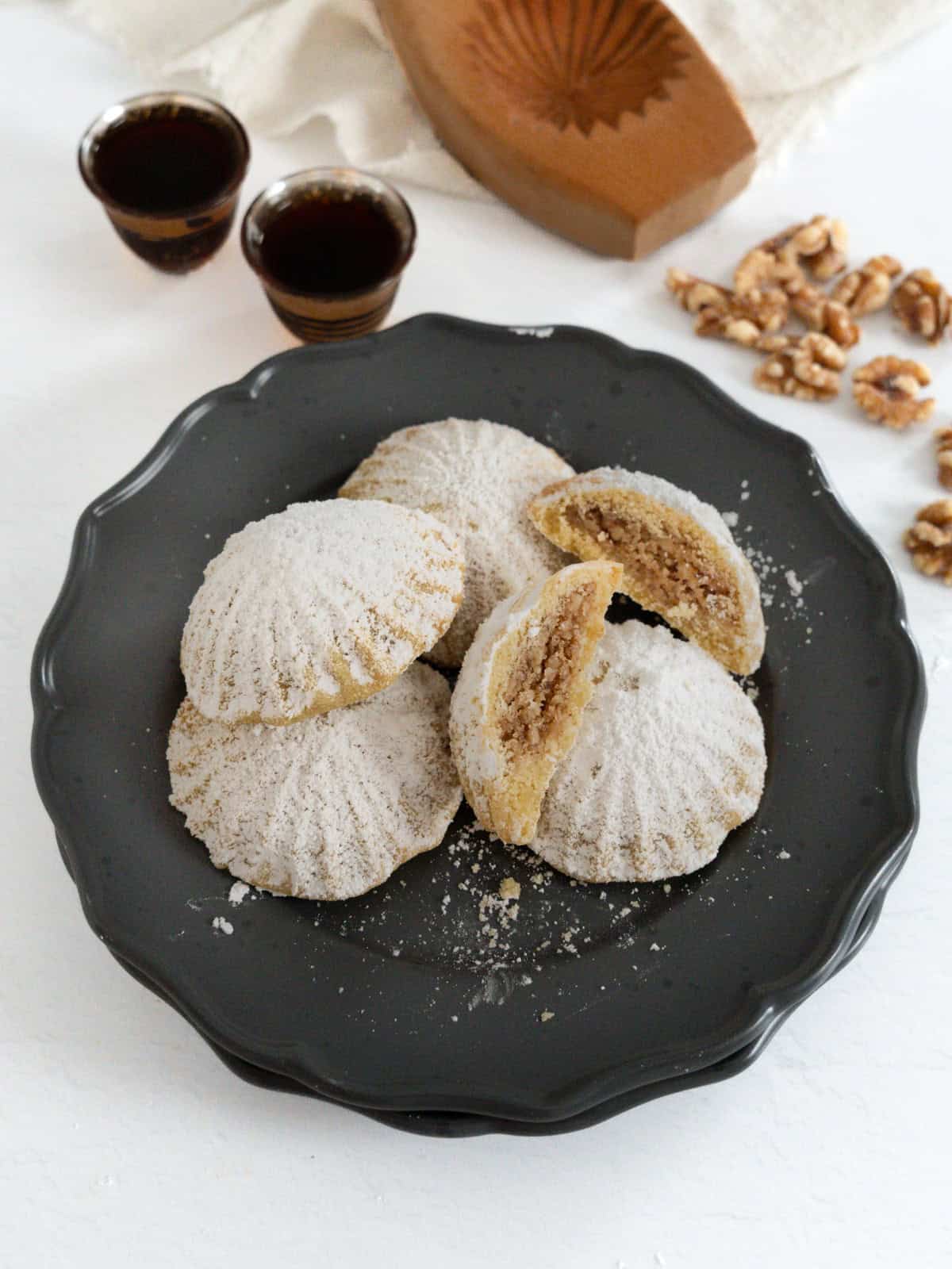 walnut filled maamoul stacked in a plate