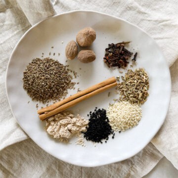 whole kaak spices laid out in a plate