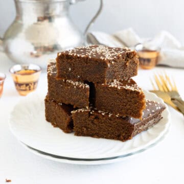 a stack of sfouf bi debes cake pieces