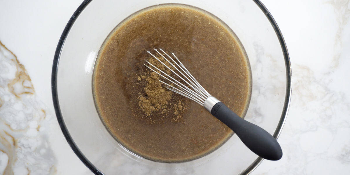 wet ingredients in a bowl with a whisk