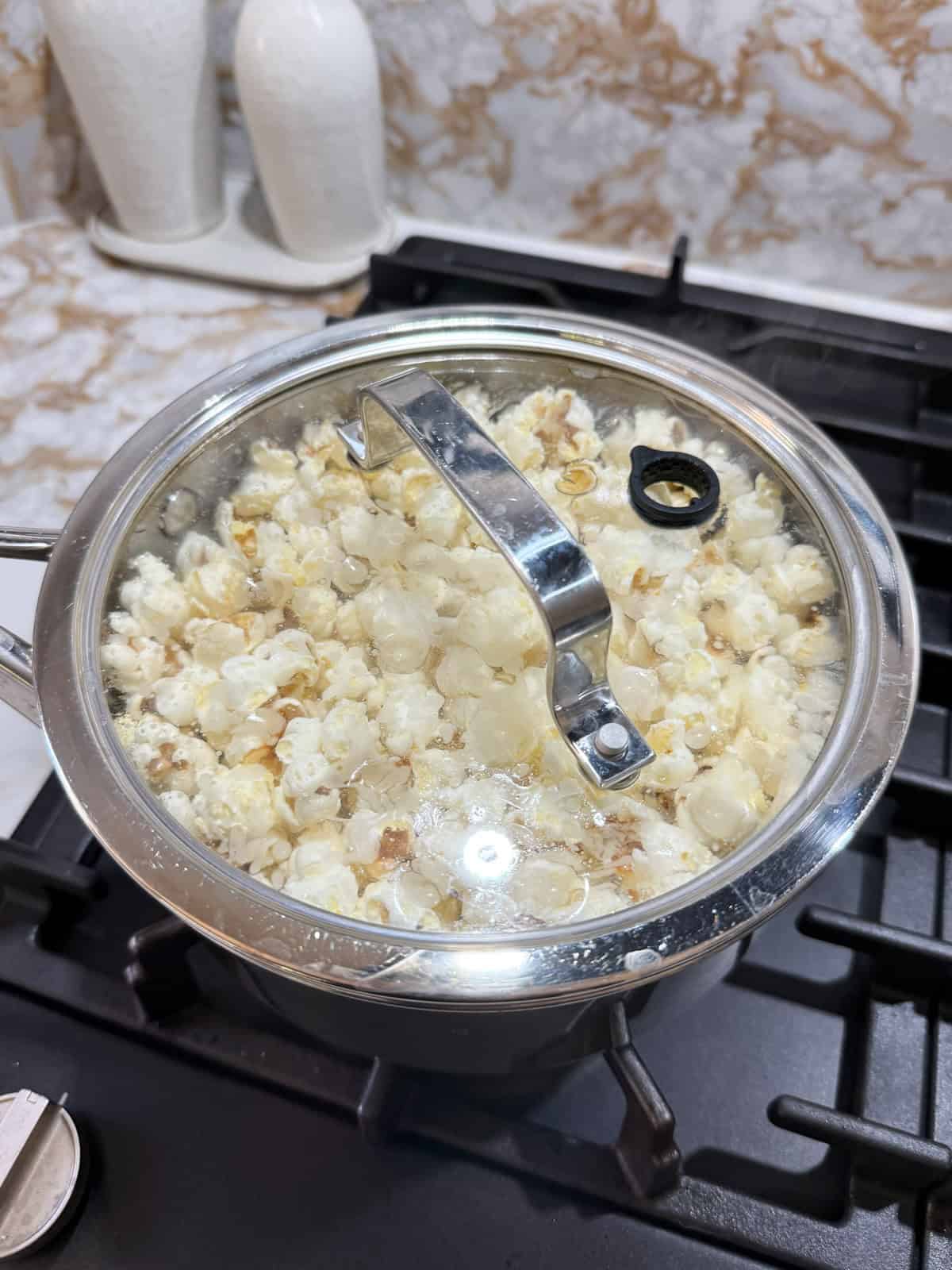 popped corn in a pot with a glass lid
