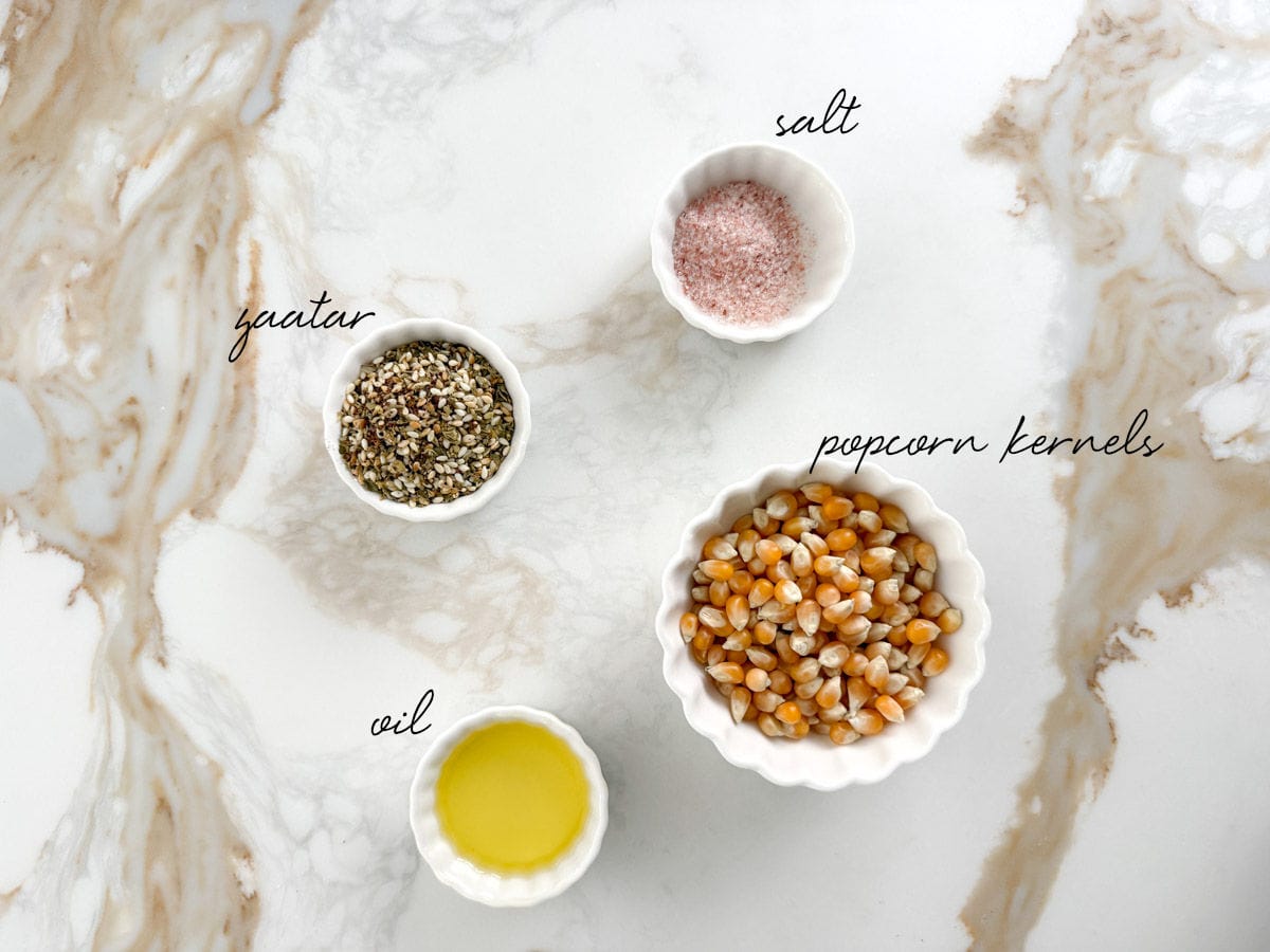 corn kernels, zaatar, salt and oil in bowls