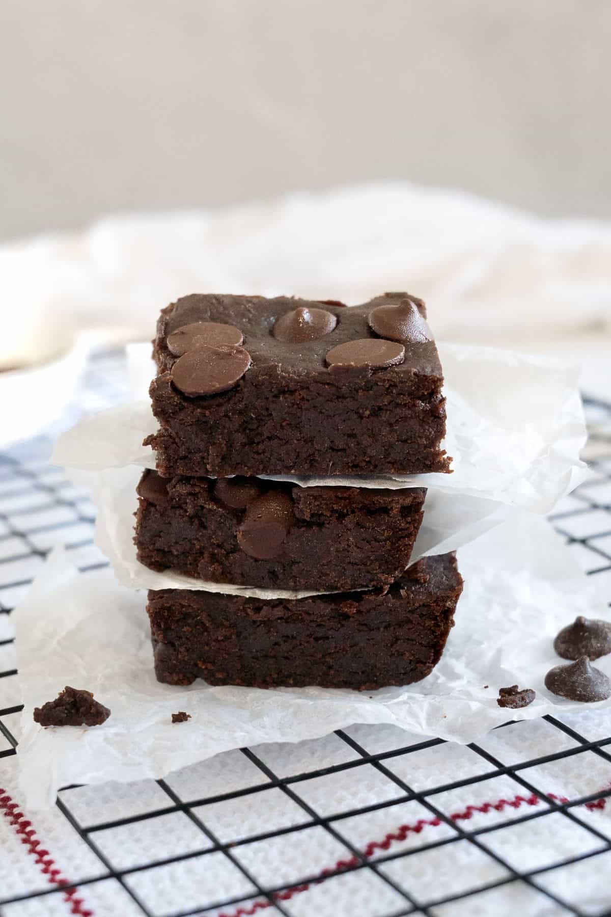 a stack of three chickpea brownies