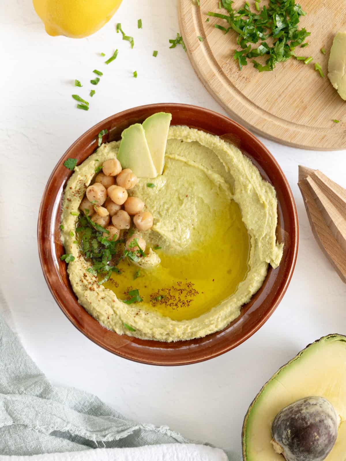 a bowl of creamy avocado hummus