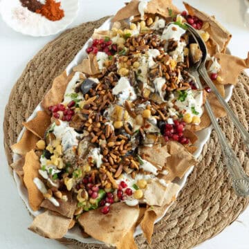 a plate of eggplant fatteh
