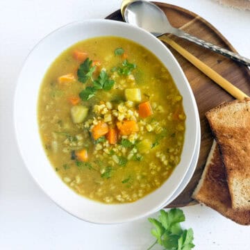 a bowl of veggie barley soup