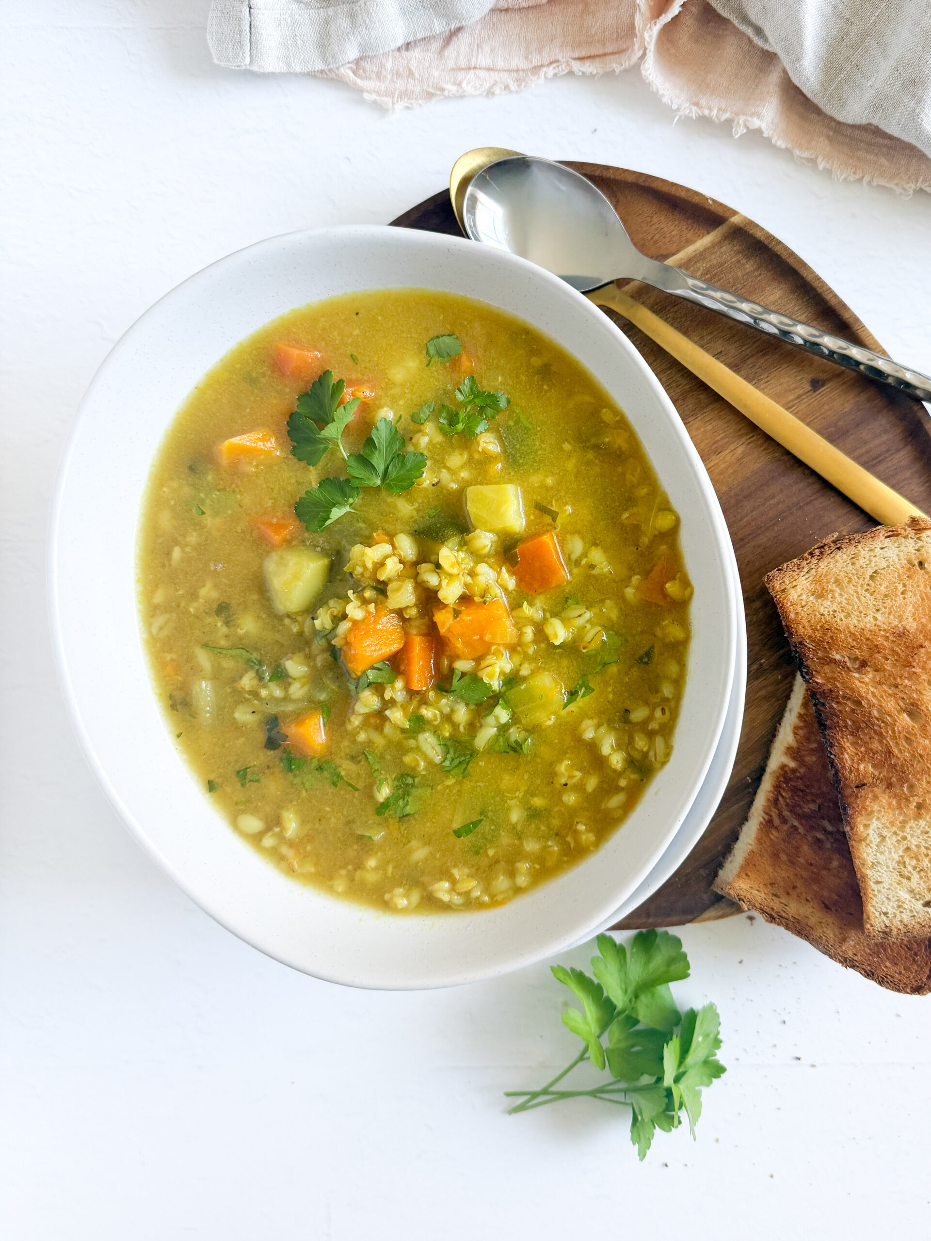 a bowl of veggie barley soup