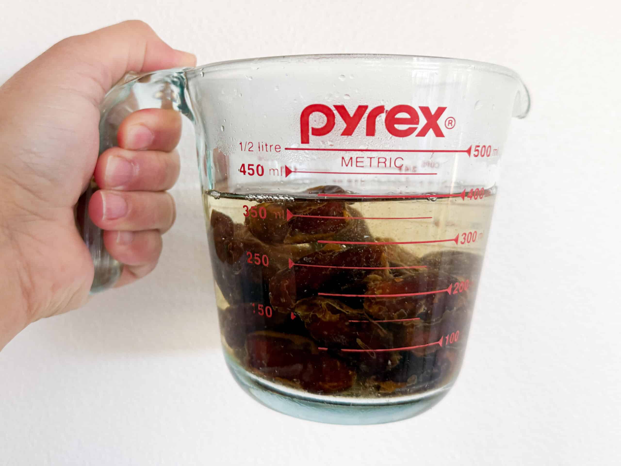 dates steeped in a jug of water
