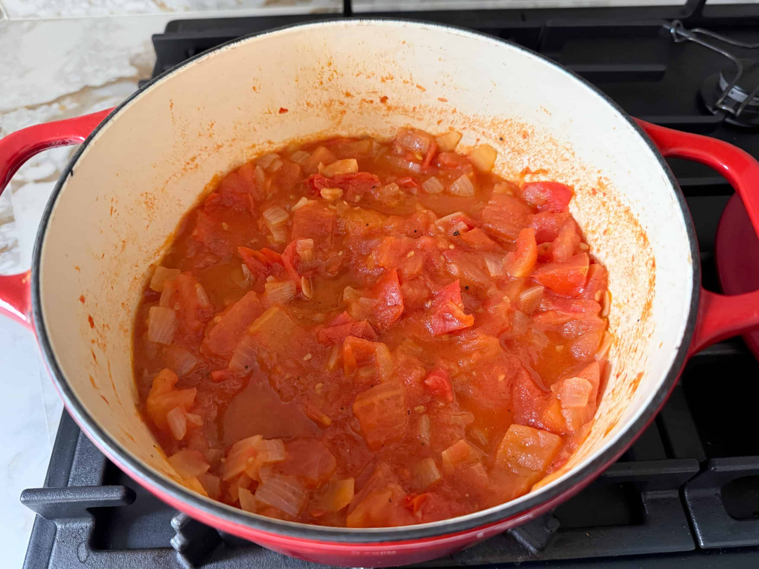 softened tomatoes and onions in a pot